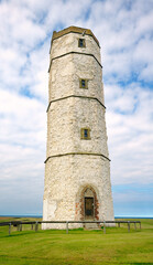 Fototapeta na wymiar The Old Lighthouse, Flamborough Head. North Sea coast of East Yorkshire, England, UK. Built with chalk stone 1673