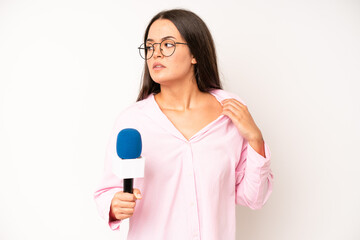 hispanic pretty woma feeling happy, surprised realizing a solution or idea. journalist with a...