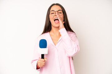hispanic pretty woma looking puzzled and confused. journalist with a microphone