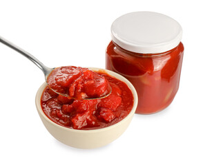 Holding spoon with delicious lecho over bowl near glass jar on white background