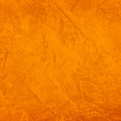 Texture of stone surface painted in orange color as background