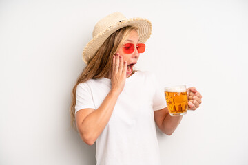 pretty caucasian woman feeling happy, excited and surprised. beer pint concept