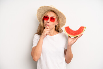 pretty caucasian woman thinking, feeling doubtful and confused. summer and watermelon concept - Powered by Adobe