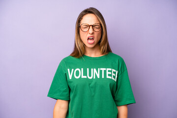 pretty caucasian woman shouting aggressively, looking very angry. volunteer concept