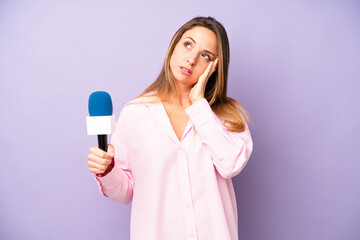 pretty caucasian woman feeling bored, frustrated and sleepy after a tiresome. journalist and...