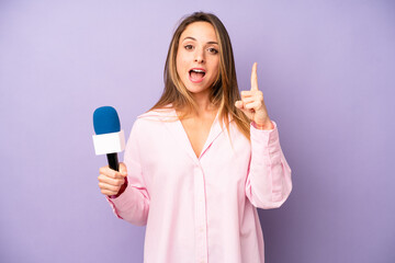 pretty caucasian woman feeling like a happy and excited genius after realizing an idea. journalist...