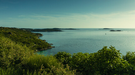 Sea landscape, Adriatic Sea, islands visible on the horizon, view of the bay and the town of Cavtat, sunny day, the sky partly covered with clouds.