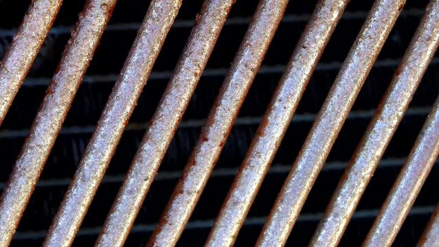 Old metal. Rusty grill. Radiator grille