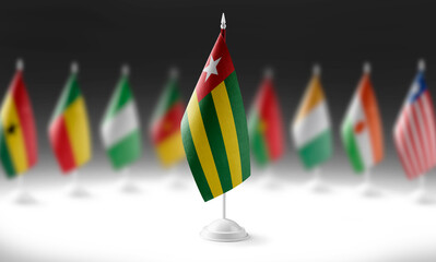 The national flag of the Togo on the background of flags of other countries