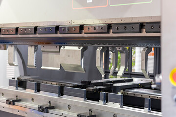 Close up punch and v die of the semi automatic cnc hydraulic press brake or bending machine  during...