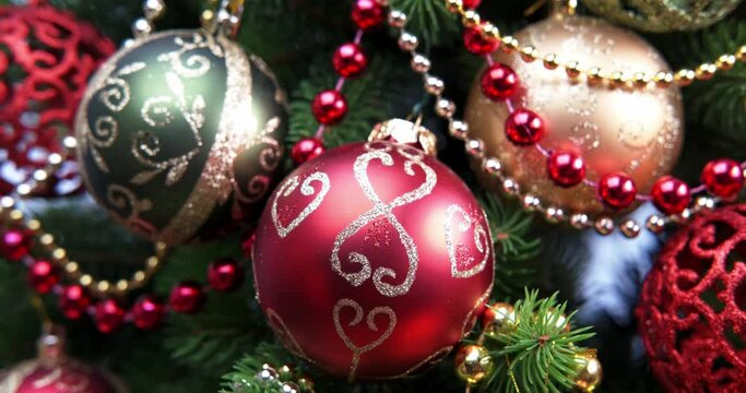 horizontal panning of christmas tree. red and gold christmas balls