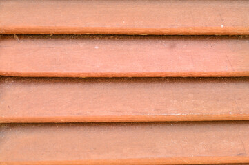 Parallel wooden carvings. Brown and old texture.