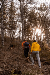 Hiking with the dog in the forest while having fun