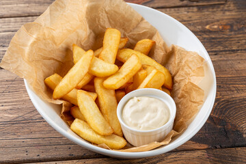 french fries with sauce on a white plate