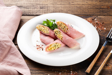 ham rolls on a white plate