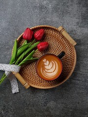 A cup of cappucino with flowers
