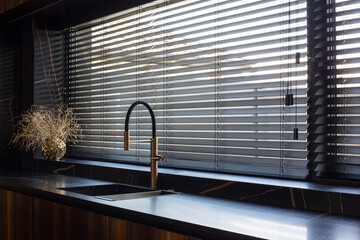 Wooden blinds black color closeup on the window. Bamboo slats 50mm wide. Venetian wood blinds in...