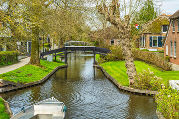 Fototapeta premium Wooden bridges over the canal in Giethoorn village, Netherlands