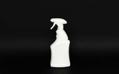 White blank plastic spray detergent isolated on black background. Packaging template mockup.