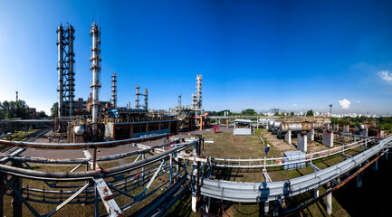 Refinery factory oil area with constructions. Petrochemical industrial background