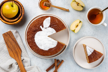 Homemade apple pie on a white wooden background, top view. The classic autumn dessert for Thanksgiving is organic apple pie.