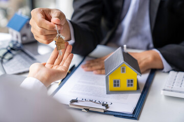 Real estate agents offer home loans and insurance after discussing and giving keys and signing an agreement with an approved application form. home insurance and real estate investment ideas