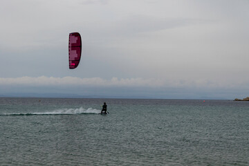 kite surfing on the sea near the beach