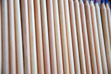 wooden pencil background. backdrop of wood pencil. stationery set with selective focus
