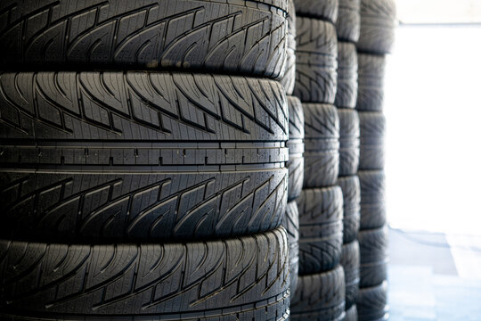 Motor sport wet rain racing car tire set close up