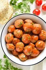 Meatballs with tomato sauce in bowl
