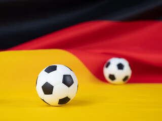 Soccer ball on the German flag. The ball against the background of the German flag.