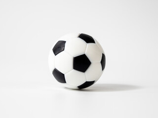 Soccer ball on a white background. Soccer ball close up. Small soccer plastic ball.