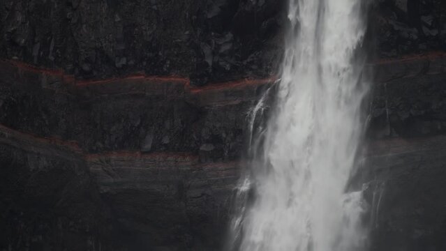 Hengifoss waterfall layers detailed view in Iceland, slow-mo