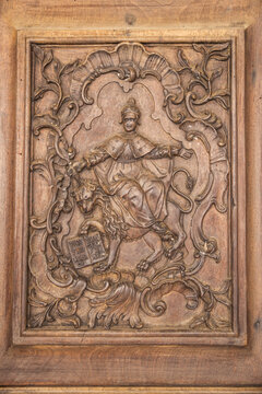 An old wooden panel with a carving of the Dodge of Venice, Italy.