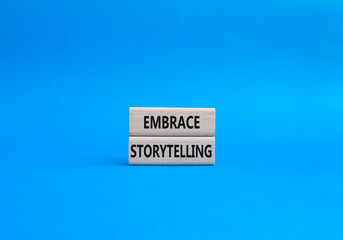 Embrace Storytelling symbol. Concept word Embrace Storytelling on wooden blocks. Beautiful blue background. Business and Embrace Storytelling concept. Copy space