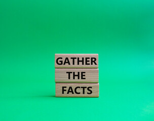 Gather the facts symbol. Wooden blocks with words Gather the facts. Beautiful green background. Business and Gather the facts concept. Copy space.