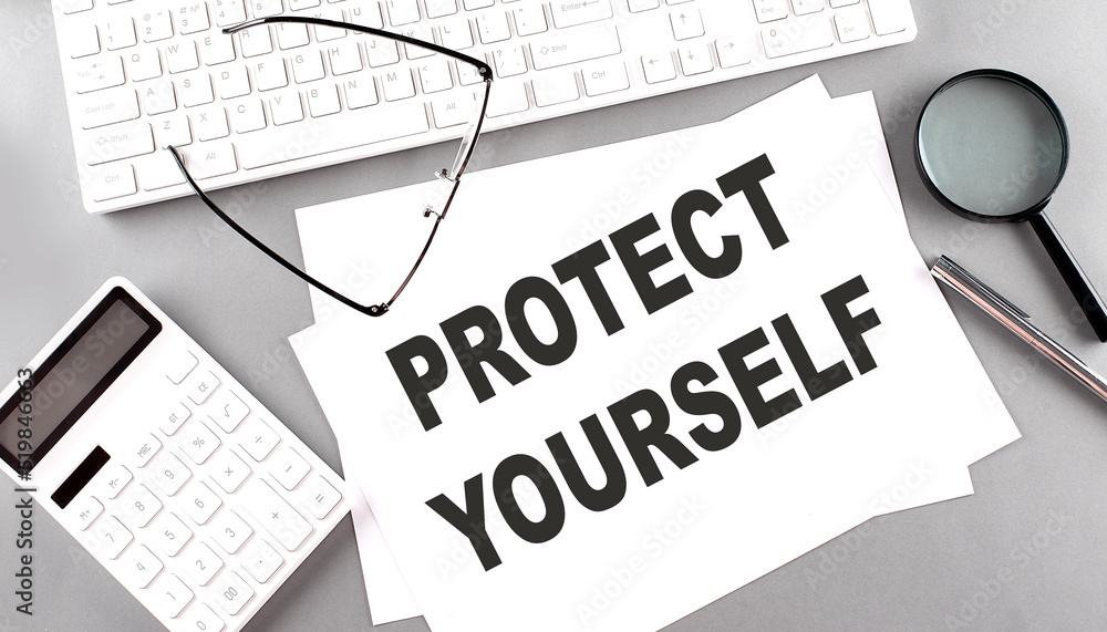 Poster protect yourself text on paper with keyboard, calculator on grey background