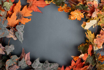 autumn decorative wreath of branches and red leaves on a gray background. copy space, flat lay - Powered by Adobe