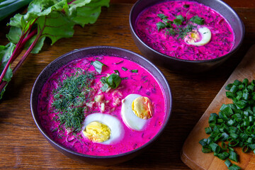 Cold beet soup - traditional cold beetroot soup with yogurt, egg, dill, chives and cucumber. A vegetarian summer dish.