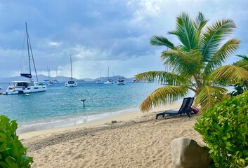 Tropical beach with anchored sailboats, British Virgin Islands