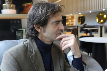 A Pensive businessman sitting at the bar