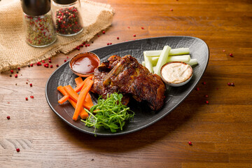 Barbecue pork ribs with sauce on wooden table