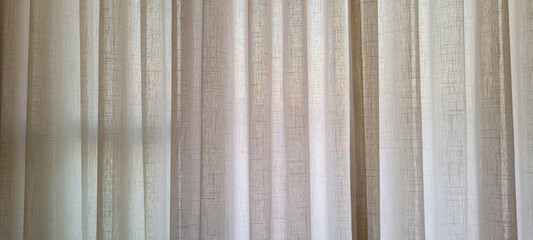 Fototapeta premium white linen curtain in apartment with sunset view in Brazil