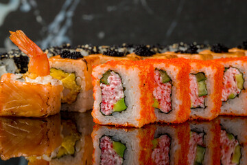 set of rolls on black with reflection