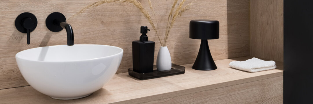 Stylish bathroom washbasin on wooden shelf, panorama