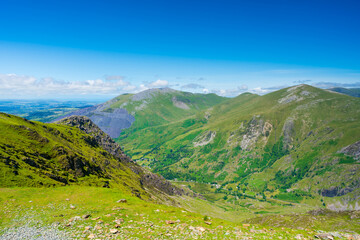 Naklejka premium A scenic view from Mount Snowdon on a bright sunny day, Wales