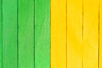 Vivid background from green and yellow wooden planks. Wooden textured background in two colours....