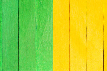 Vivid background from green and yellow wooden planks. Wooden textured background in two colours....