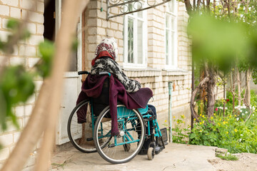 Fototapeta na wymiar very old woman in a wheelchair
