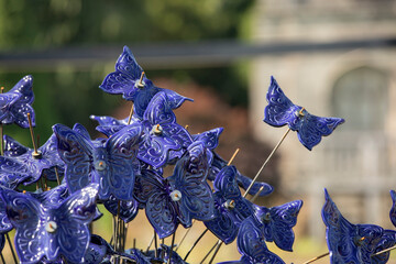Trentham stoke on Trent United Kingdom 11 July 2022 a modern sculpture made up of hundreds of ceramic butterflies in the italian gardens at trentham gardens